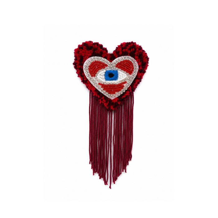 Broche touffetée faite main, La Montre