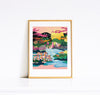 Colorful artwork of a sunset over the city of Montreal, framed in gold on a white wall.
