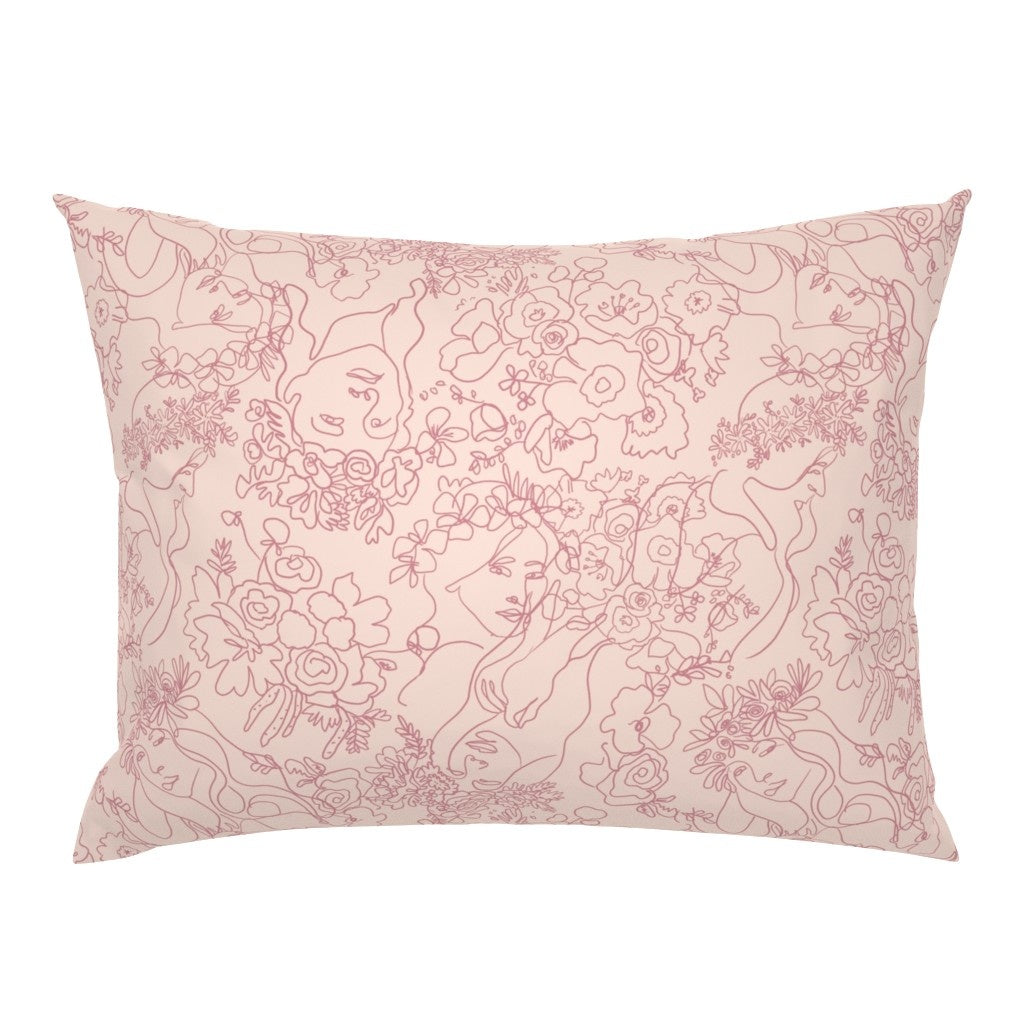 Lacey mulberry silk pillowcase in blush pink with delicate line-drawn feminine faces among roses and florals