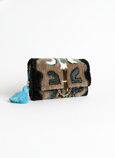 Clean product photo of earth-toned clutch