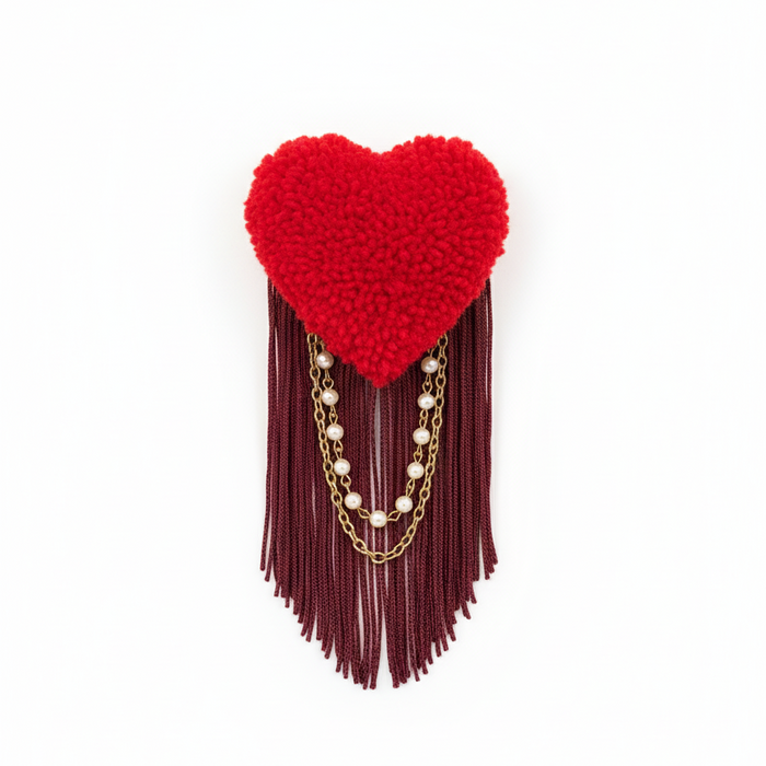 Clean product photo of red heart brooch with fringe
