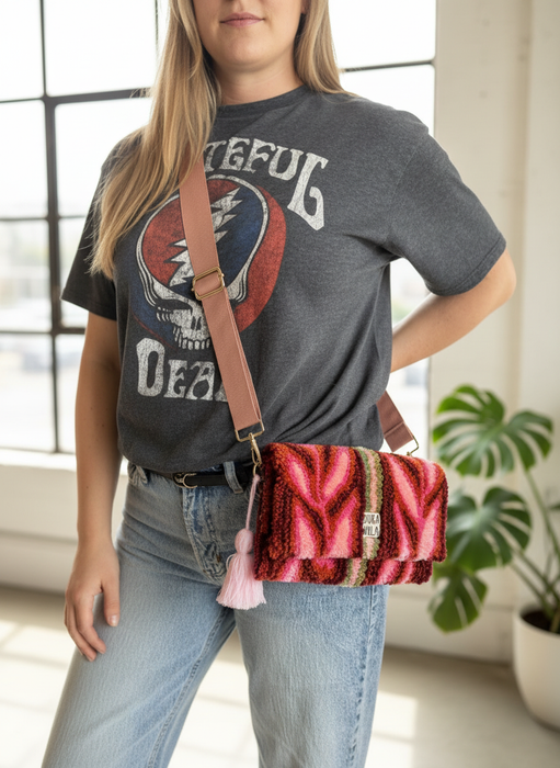 Editorial fashion photo with model wearing tufted clutch