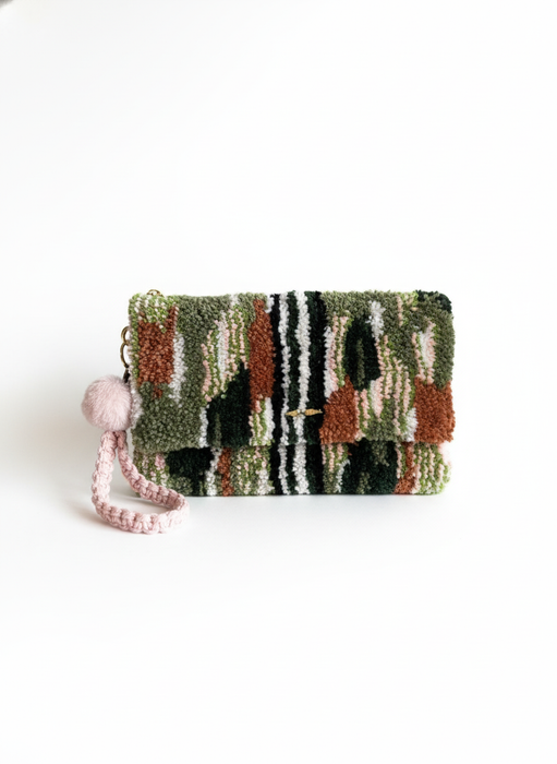 Front view tufted clutch on white background