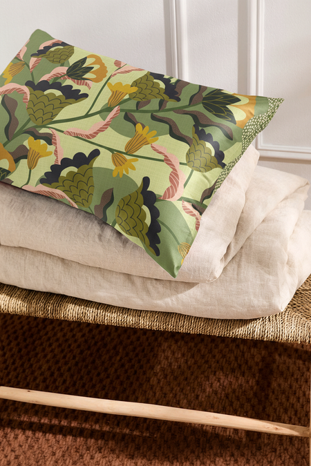 Green botanical silk pillowcase on pillow