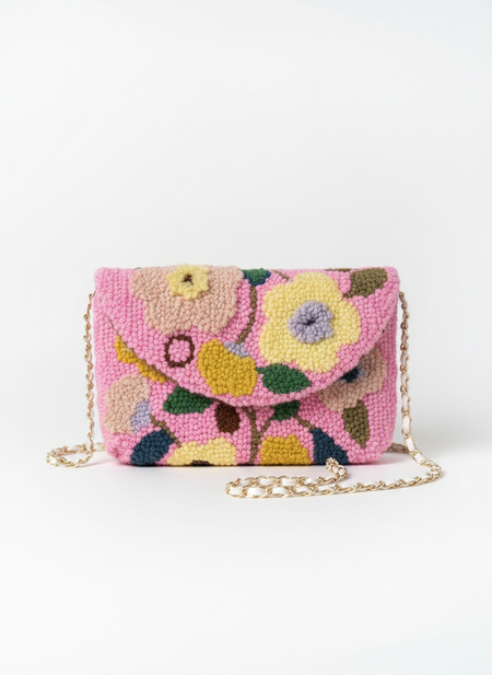 Magical product photo of punch needle floral clutch
