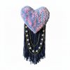 Pink and blue tufted heart brooch with soft realistic lighting