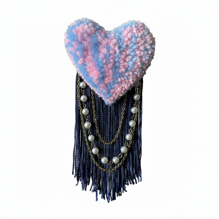Pink and blue tufted heart brooch with soft realistic lighting