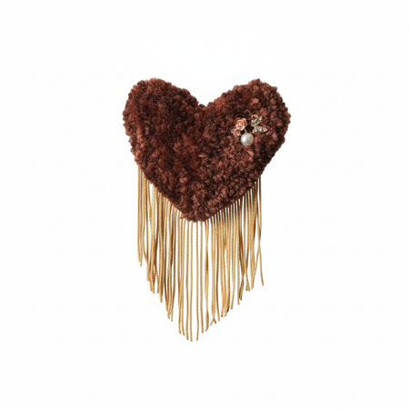 Professional product photo of brown tufted heart brooch with gold fringe