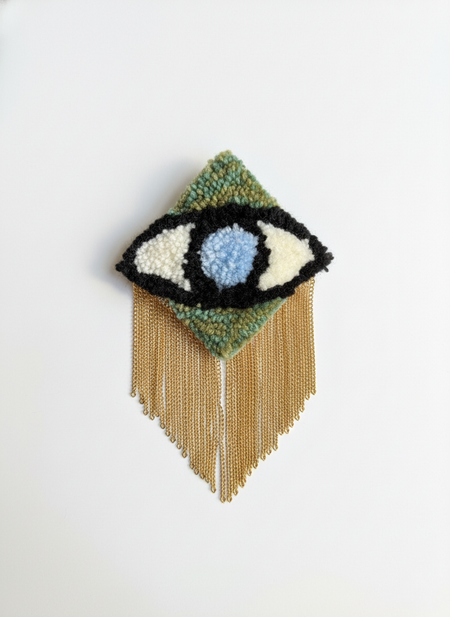Professional product photo of evil eye brooch