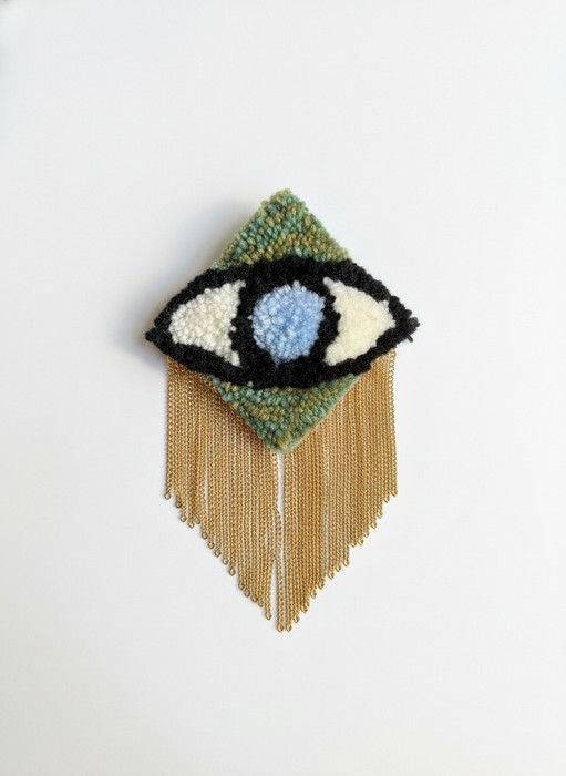 Professional product photo of evil eye brooch