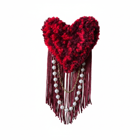 Professional product photo of red tufted heart brooch with pearls