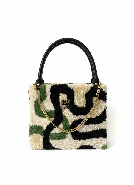 Professional symmetrical top handle handbag photo